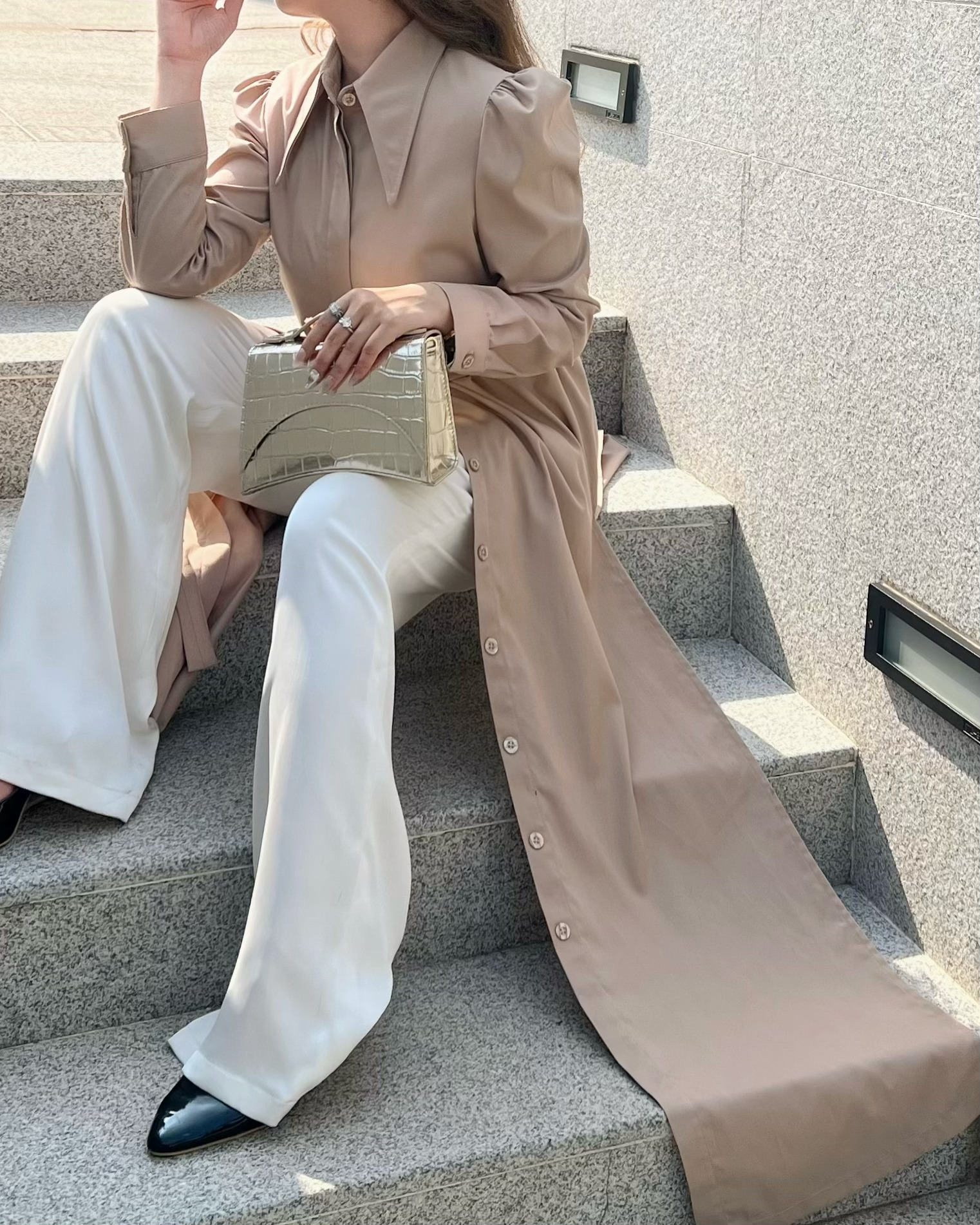 Old money style featuring an elegant neutral-toned outfit paired with a gold crocodile leather handbag